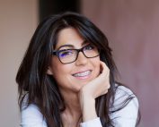 Portrait of a Beautiful Woman with Braces on Teeth. Orthodontic Treatment. Dental Care Concept